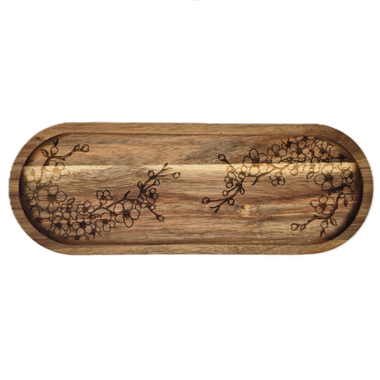 Wooden tray with floral patterns on a white background