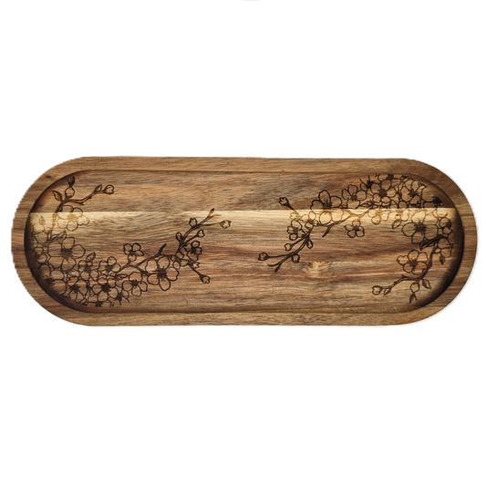 Wooden tray with floral patterns on a white background