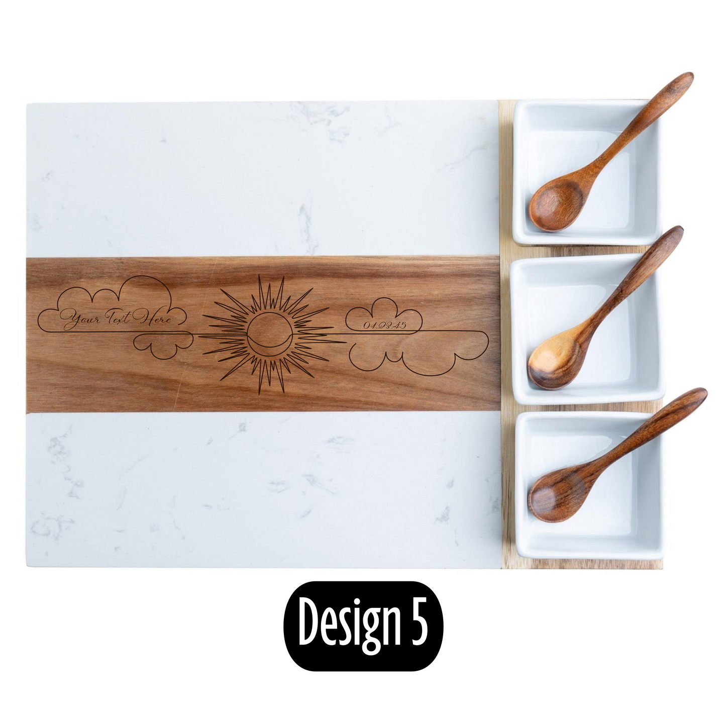 Wooden cutting board with engraved designs on a marble surface with wooden spoons.